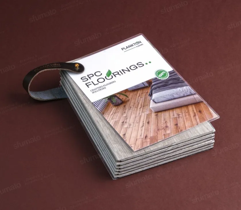 Compact branded swatch deck held in one hand